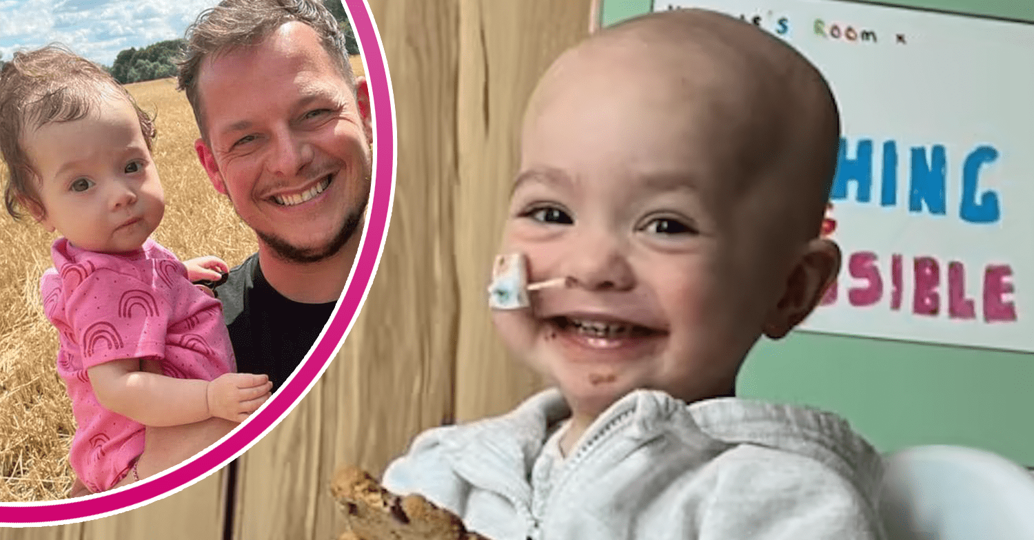 Little girl smiling in hospital and being held by her dad