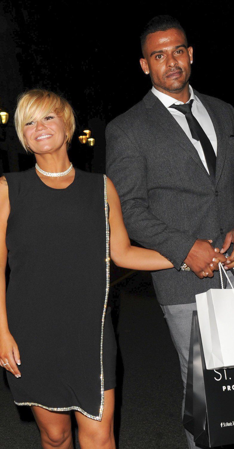 Kerry Katona holding hands with George Kay