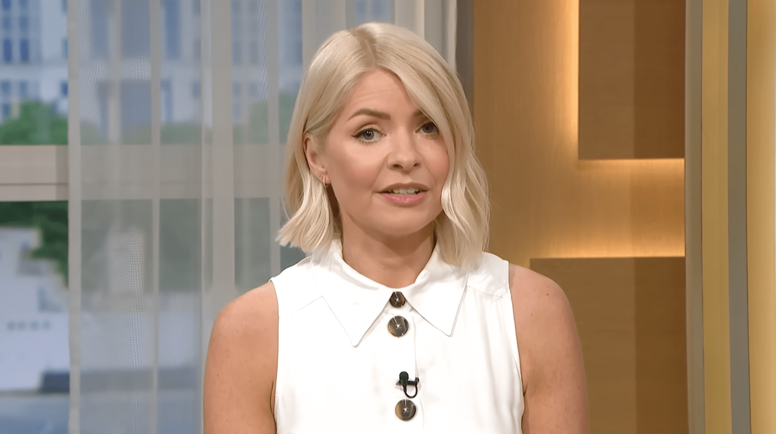 Holly Willoughby presenting This Morning in a white dress
