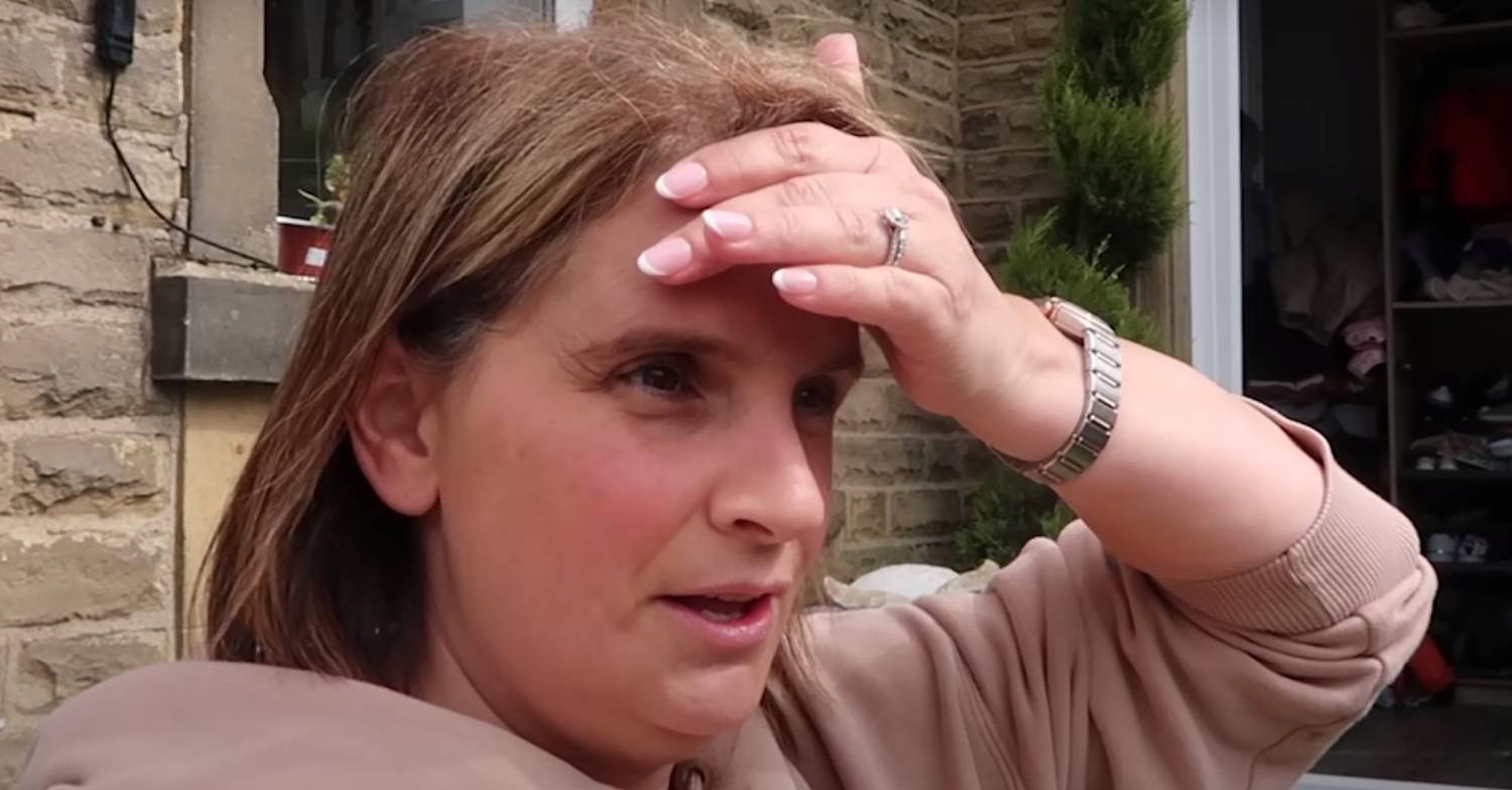 Sue Radford puts her hand to her brow