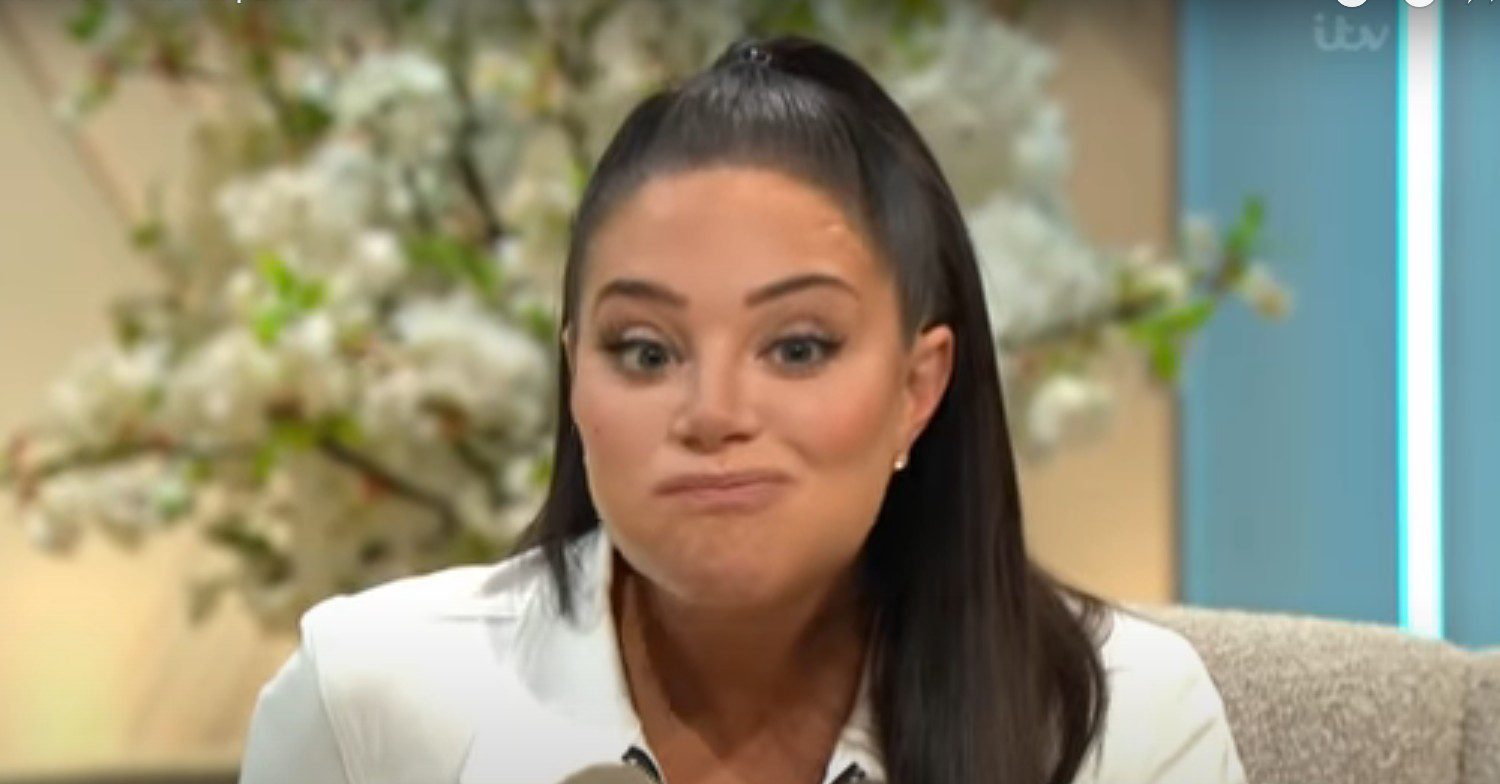 Tulisa puffing out her cheeks