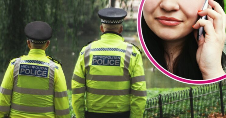 Police officers in uniform with a woman on the phone