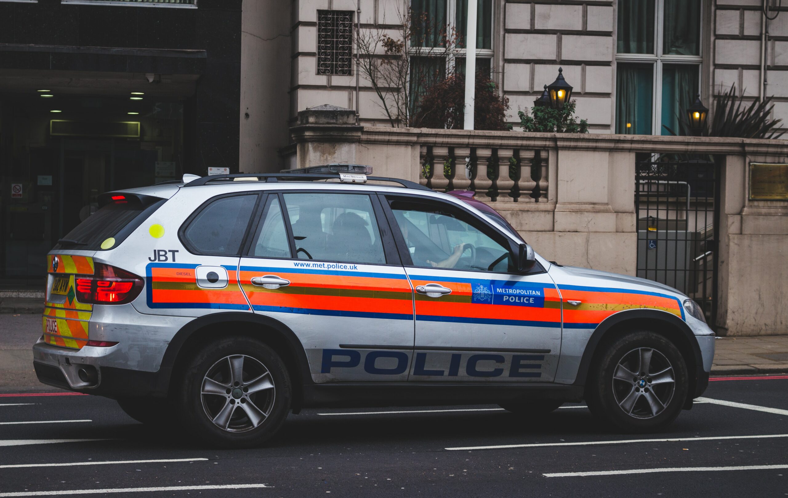 A police car responding to a call in London