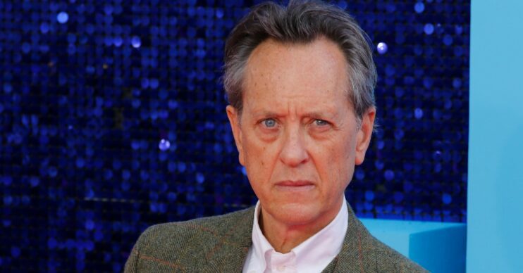 Richard E Grant looking stern