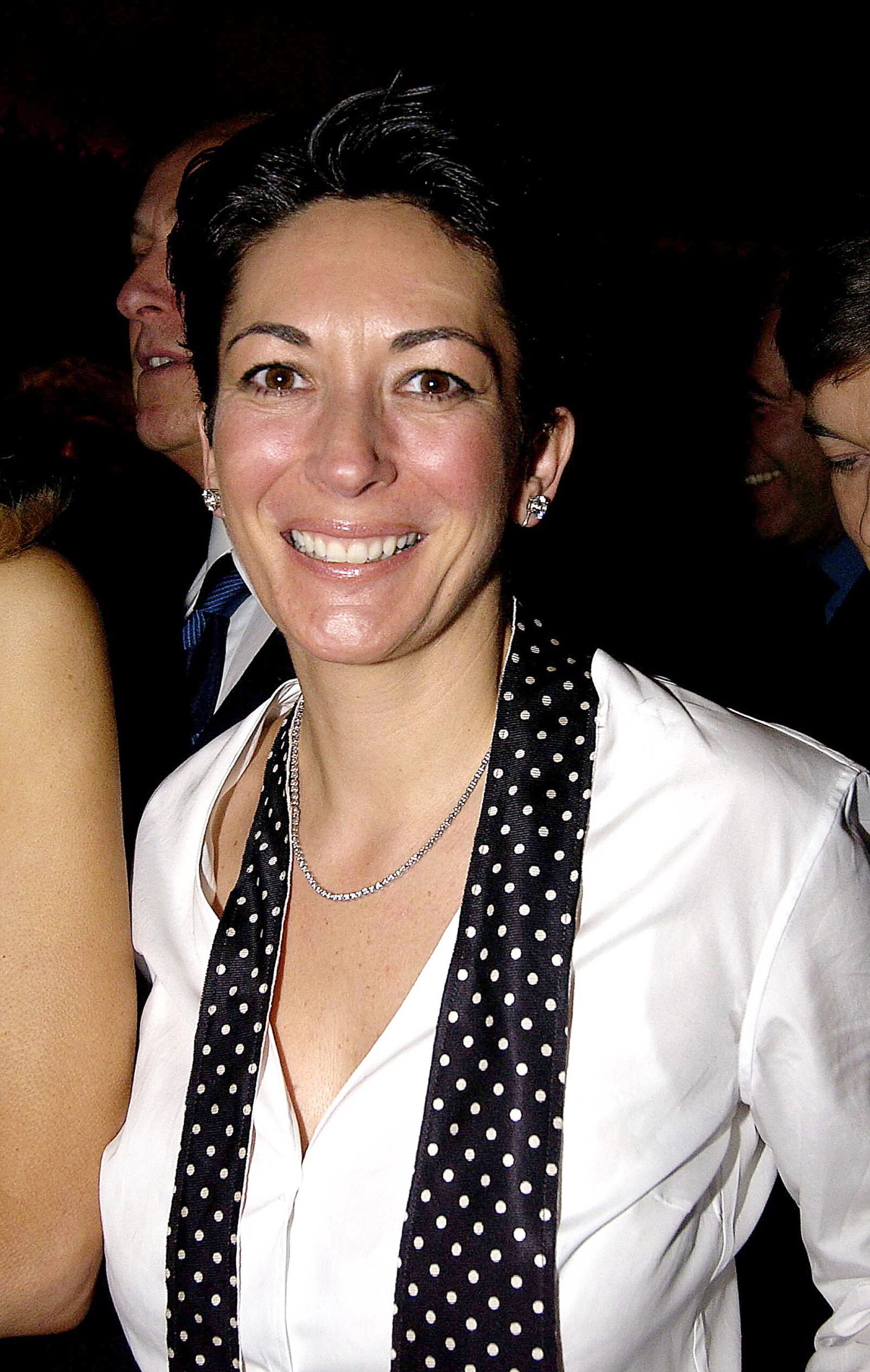 Ghislaine Maxwell smiles at camera