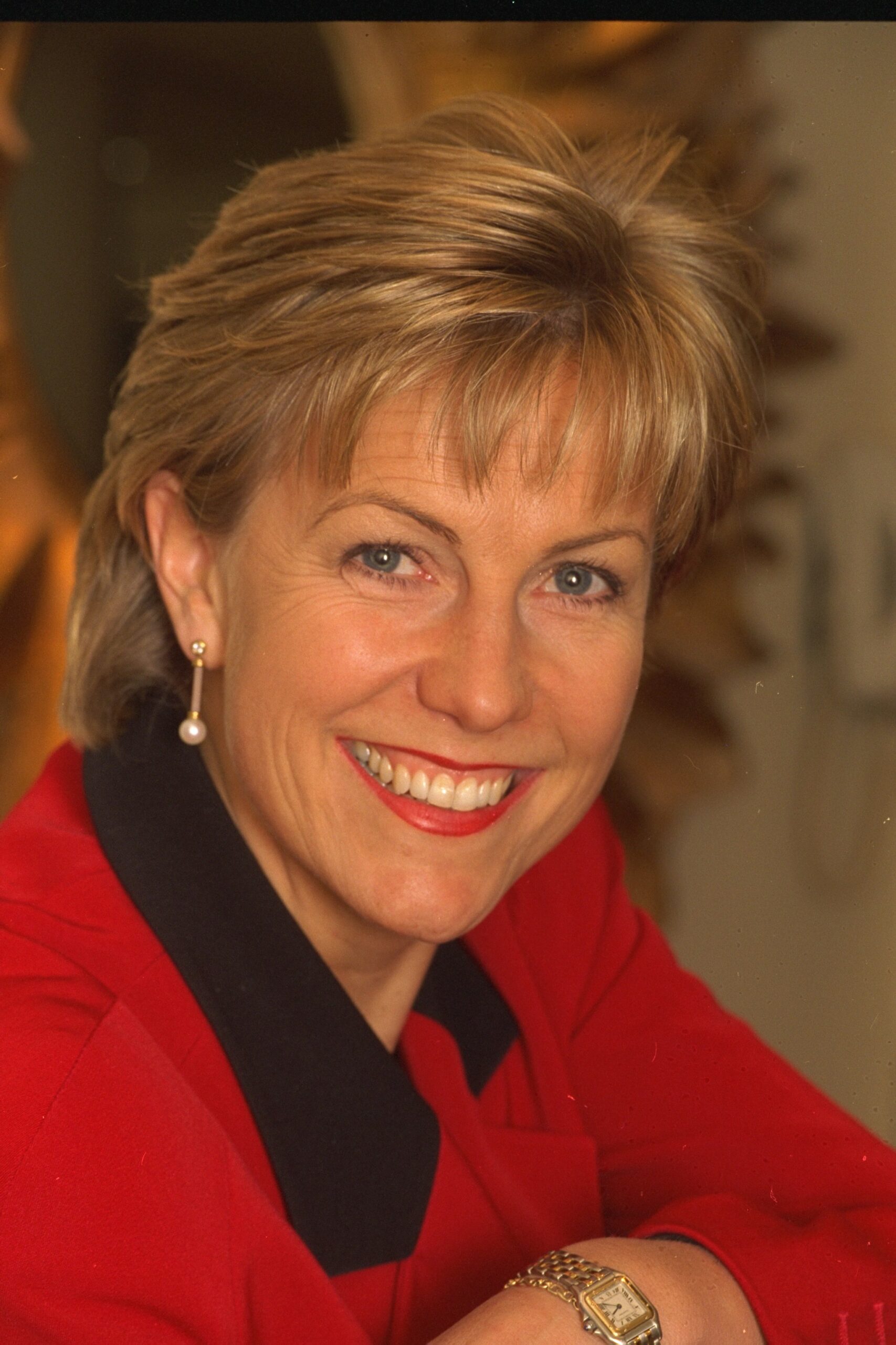 Jill Dando smiling wearing red