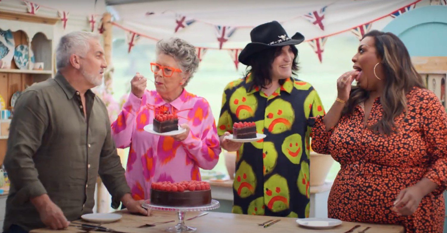 Alison Hammond eating cake with The Great British Bake Off judges Prue Leith and Paul Hollywood and co-host Noel Fielding.