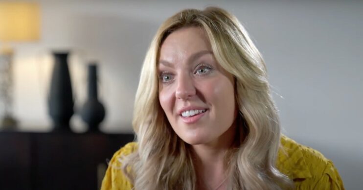 Amy Dowden wearing a yellow T-shirt smiling