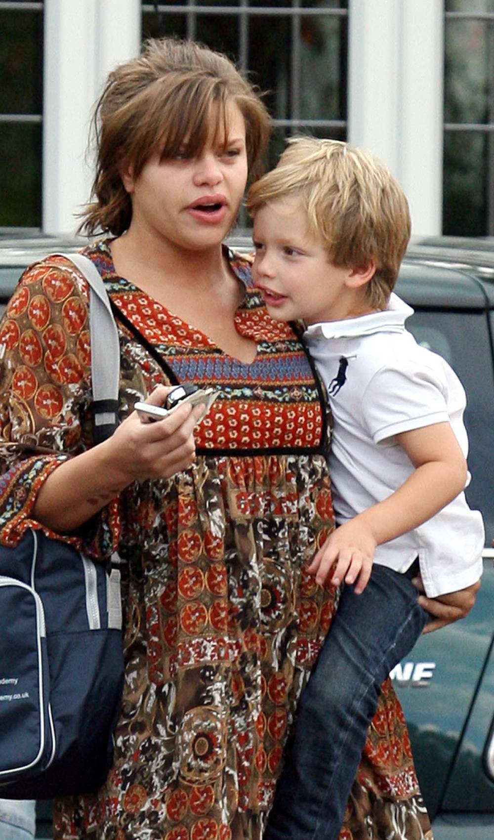 Bobby Brazier as a child is carried by his mum Jade Goody