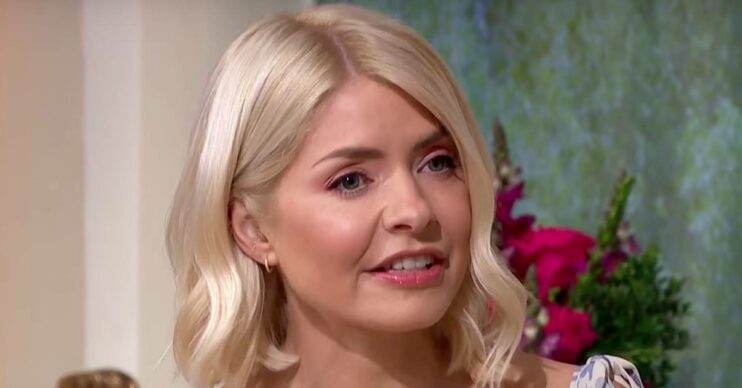 Holly Willoughby looks to her side