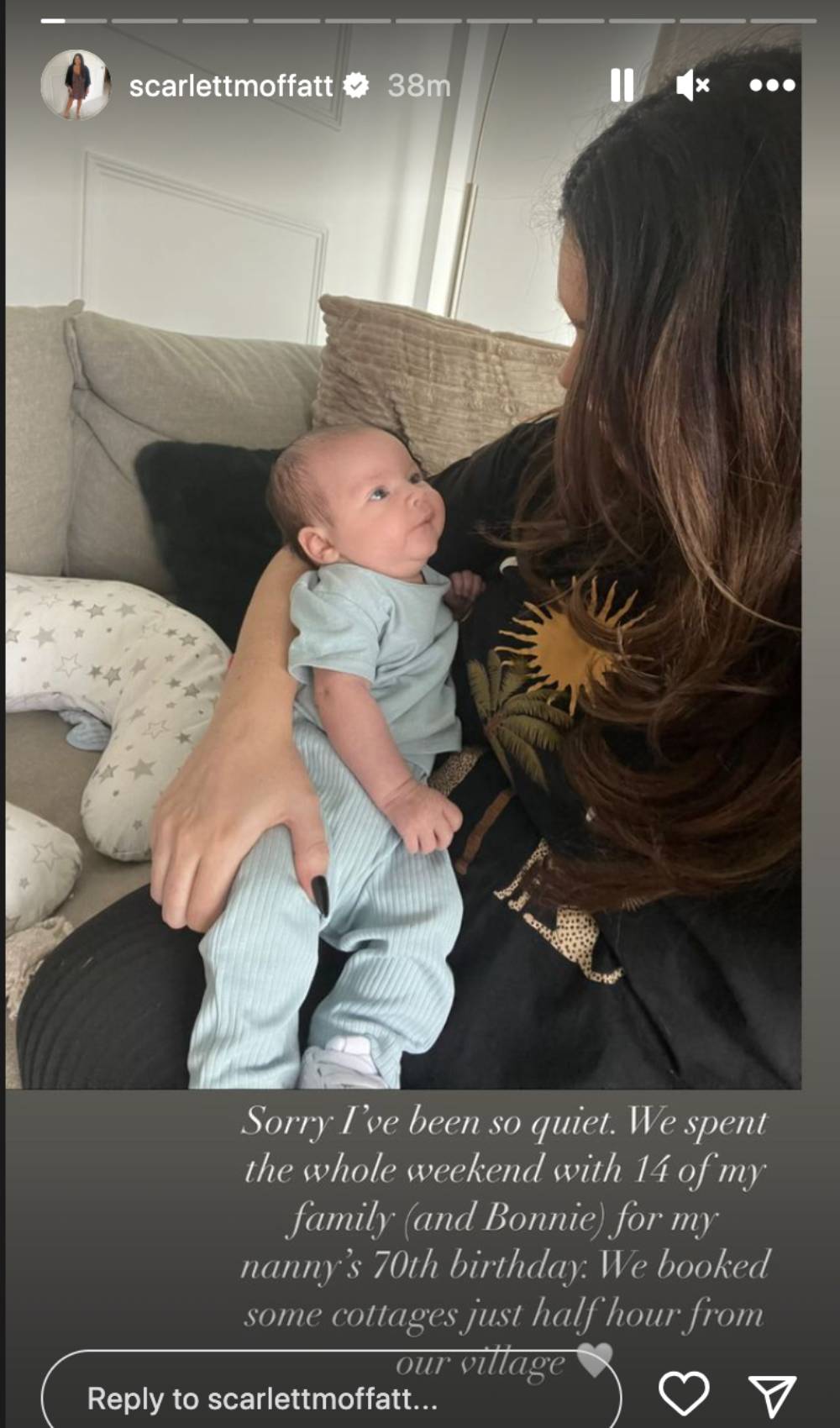 Scarlett Moffatt cradles her son
