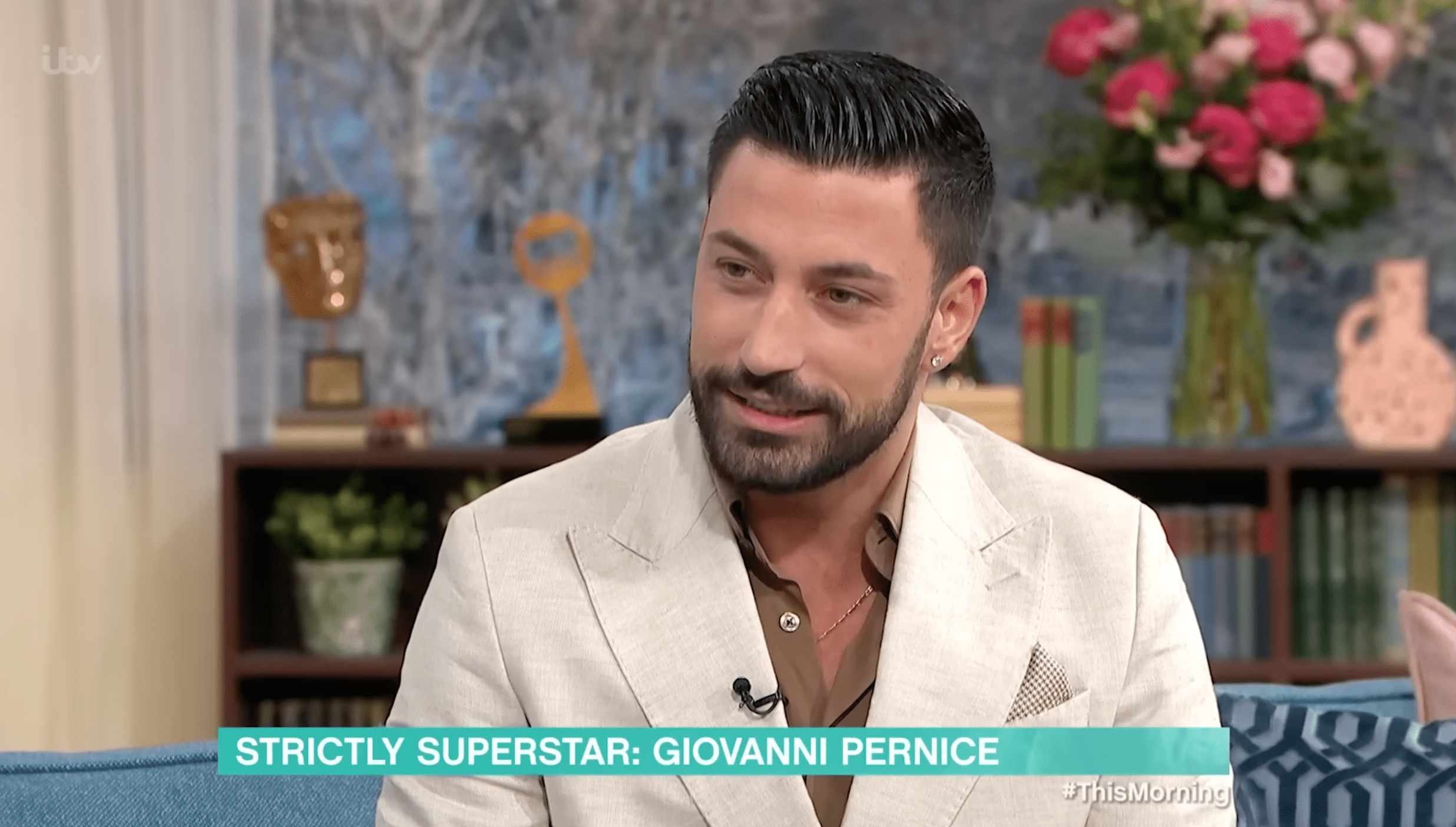 Giovanni Pernice being interviewed on This Morning and smiling