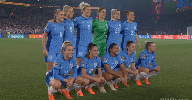 Lionesses lined up in a blue kit