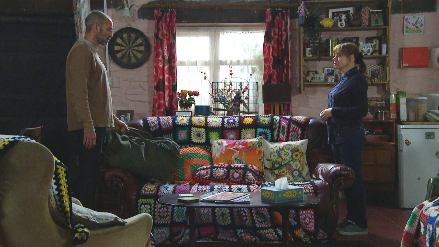 Sam and Lydia in Emmerdale are worlds apart as they look heartbroken at each other across the sofa