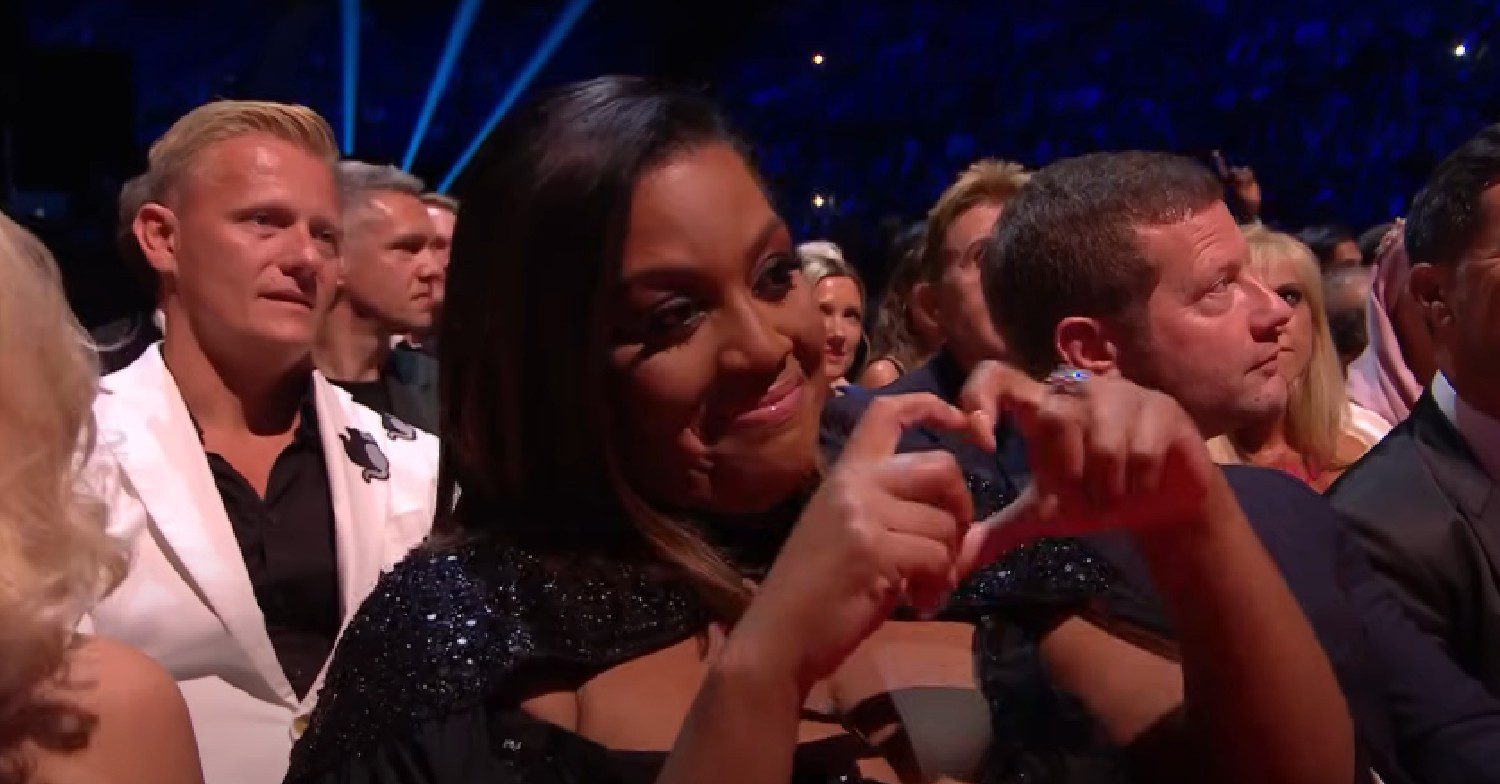 Alison Hammond makes a heart sign with her hands at the NTAs 2023