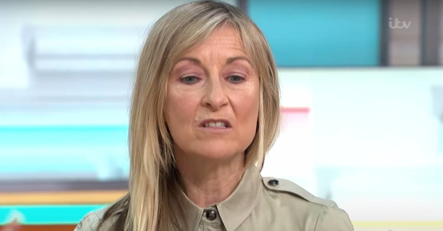Fiona Phillips looks downwards