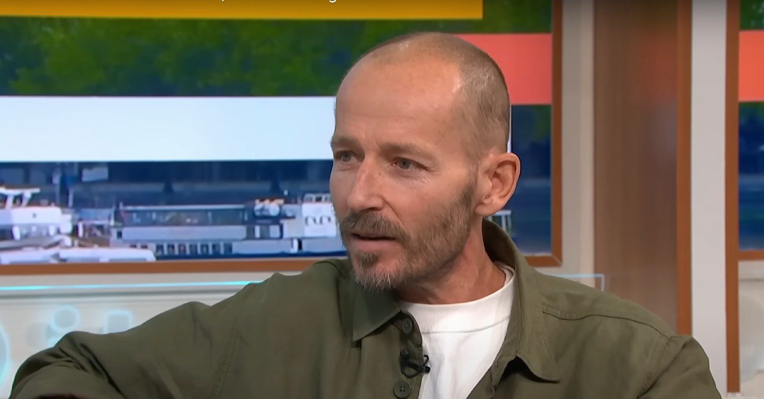 Jonnie Irwin sat on a sofa talking while on the ITV show Good Morning Britain