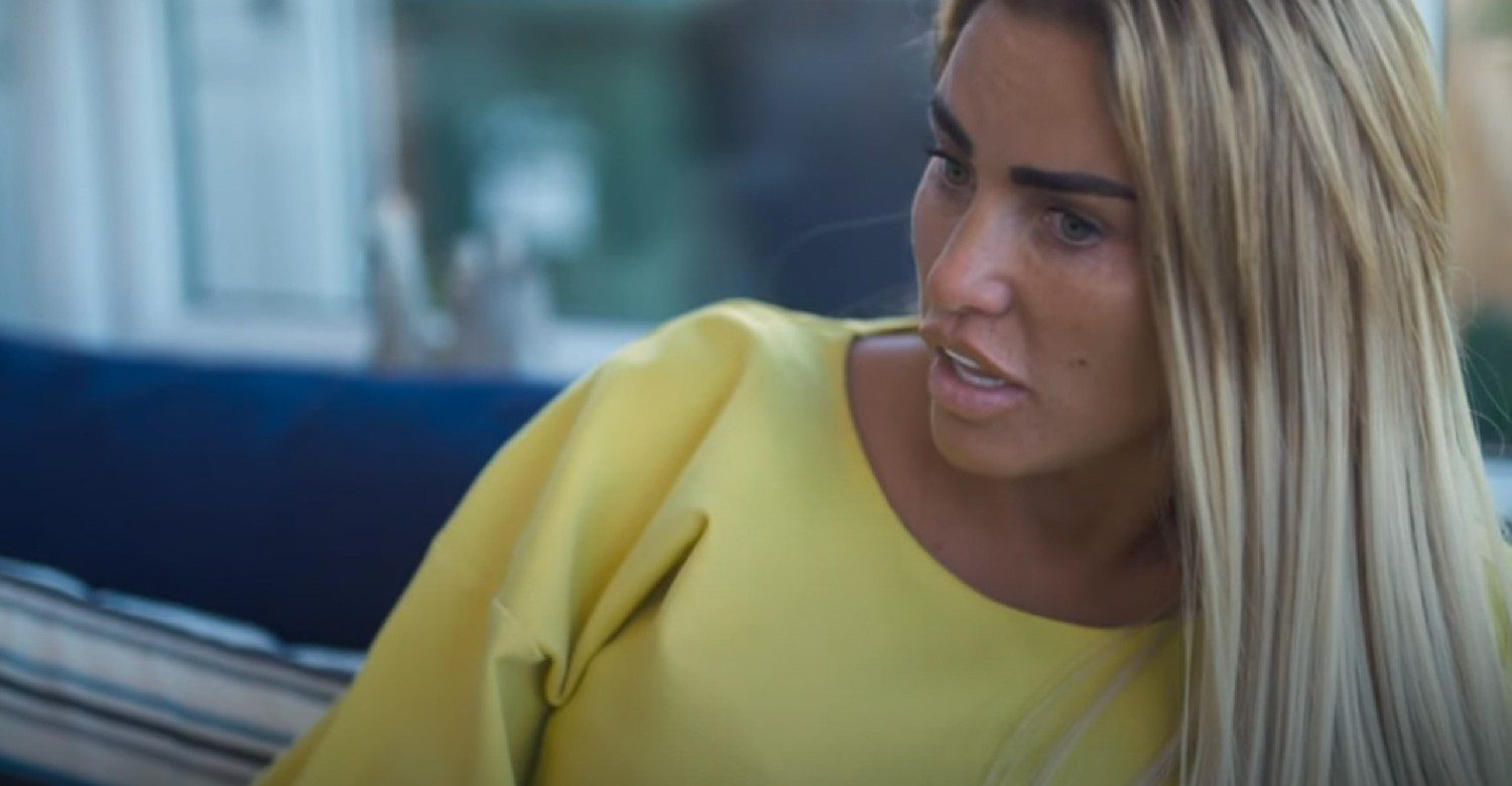 Katie Price talking while wearing a yellow top