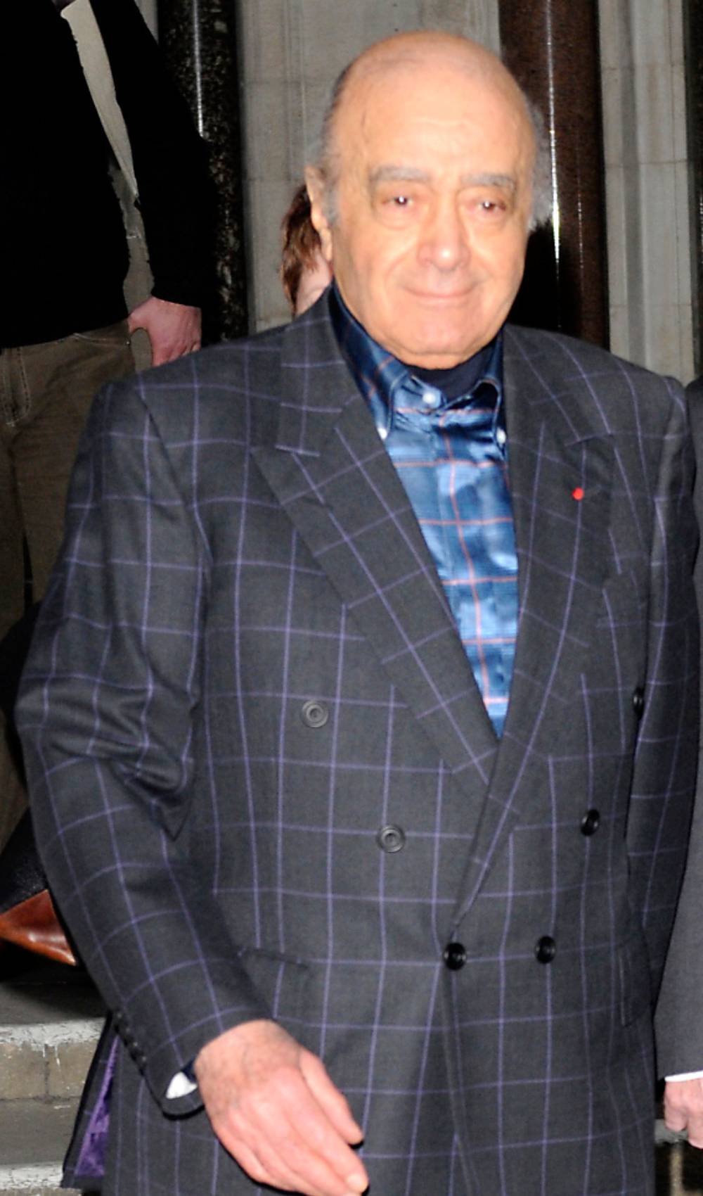 Mohamed Al Fayed smiles
