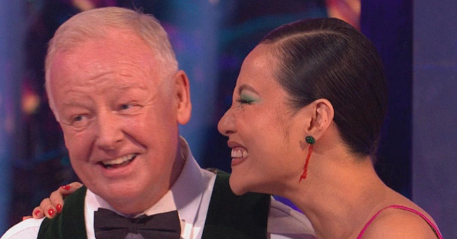 Strictly professional Nancy Xu seen with blood on her neck as she stands next to Les Dennis