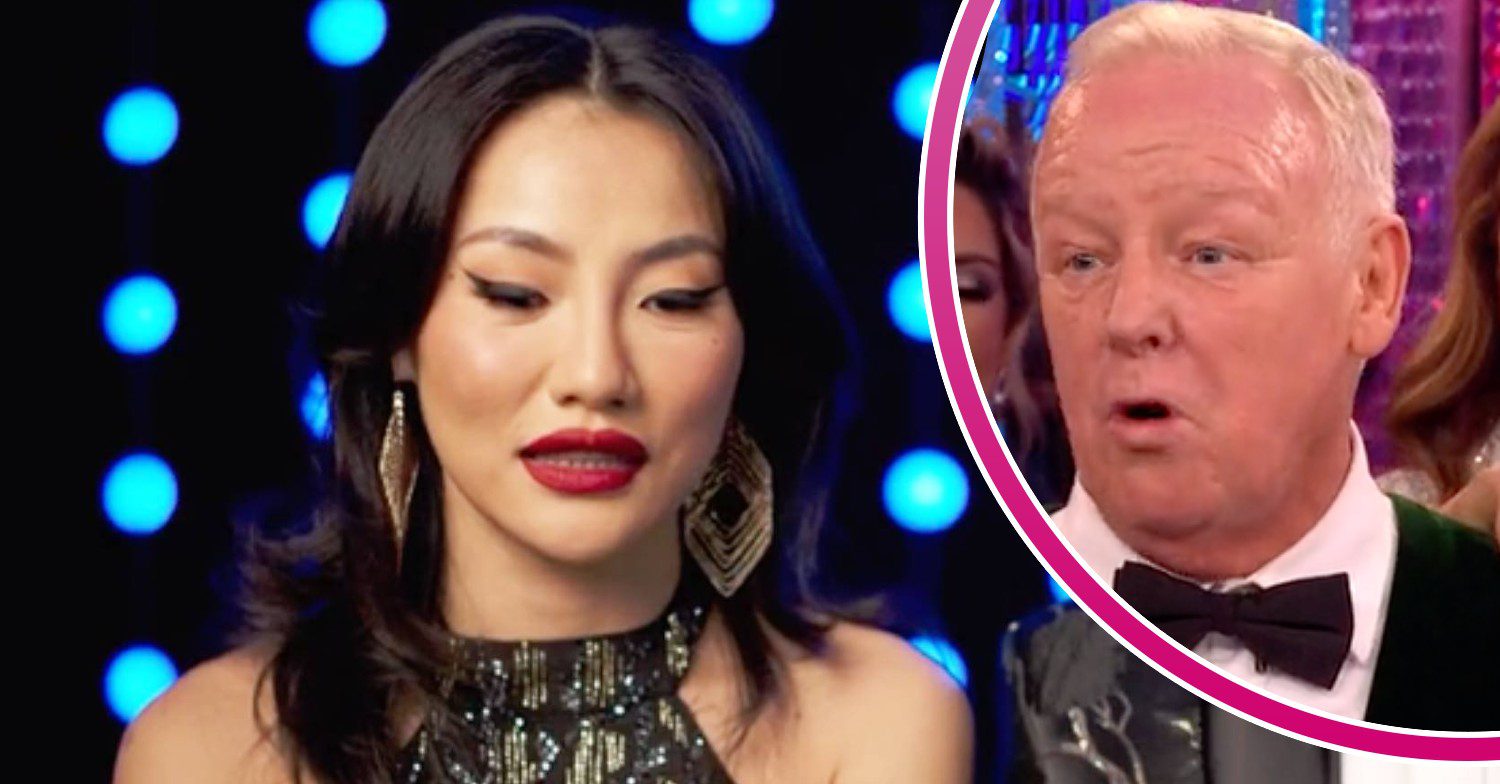 Nancy Xu looks down, her Strictly partner Les Dennis looks surprised