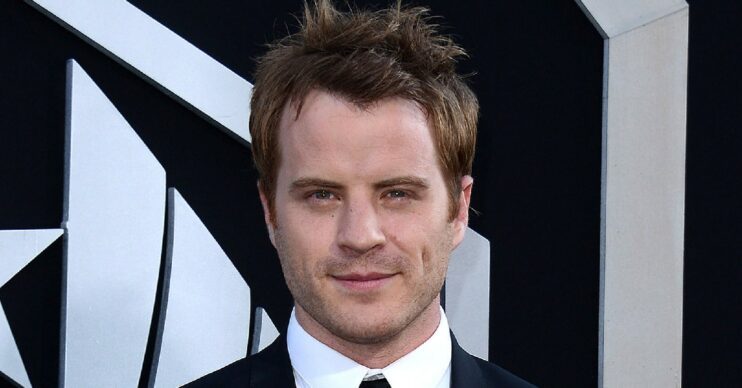 EastEnders star Rob Kazinsky smiling at event