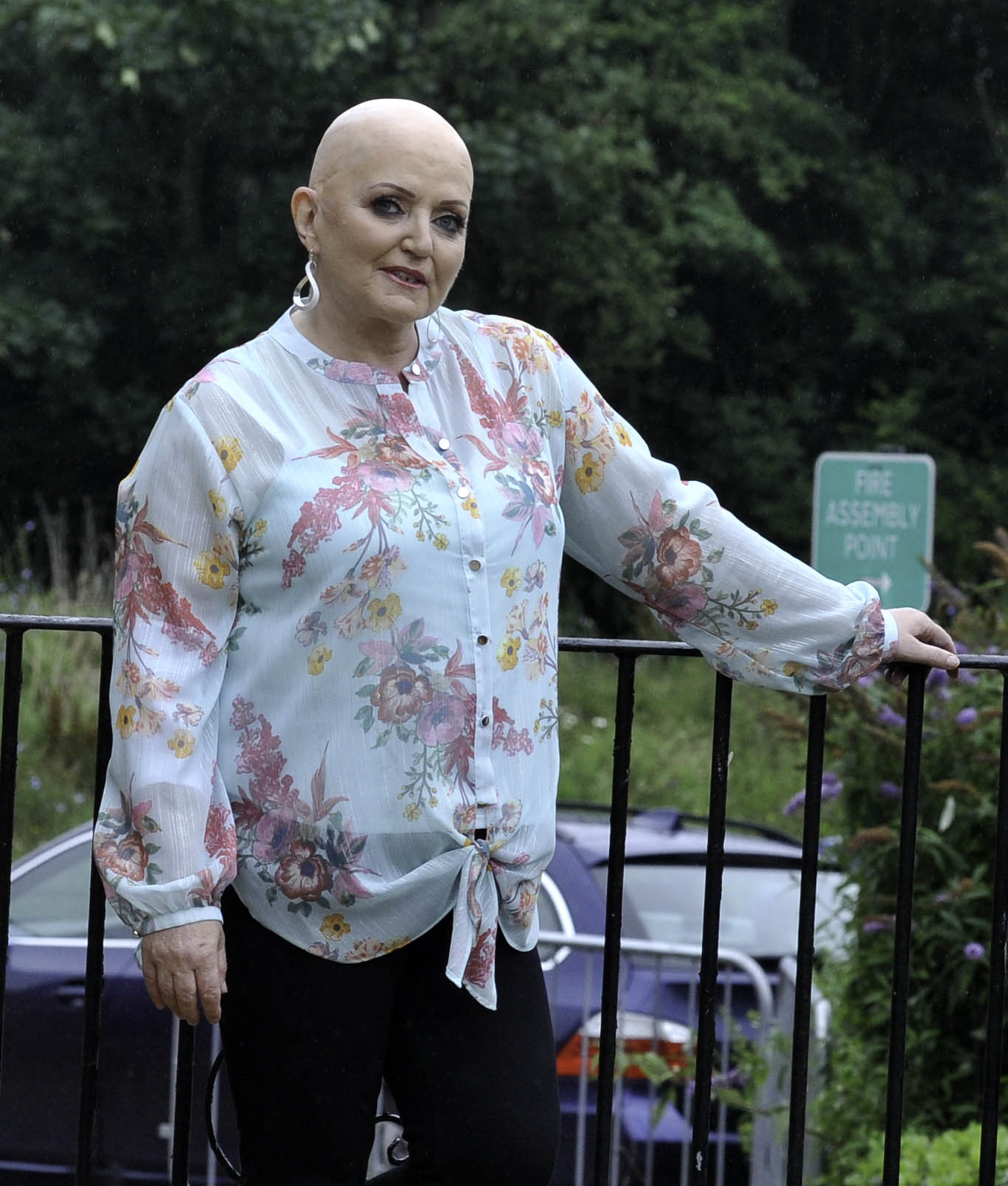 Linda Nolan smiling in a floral top