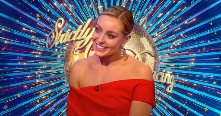 Strictly professional dancer Amy Dowden smiling in front of the Strictly Come Dancing logo