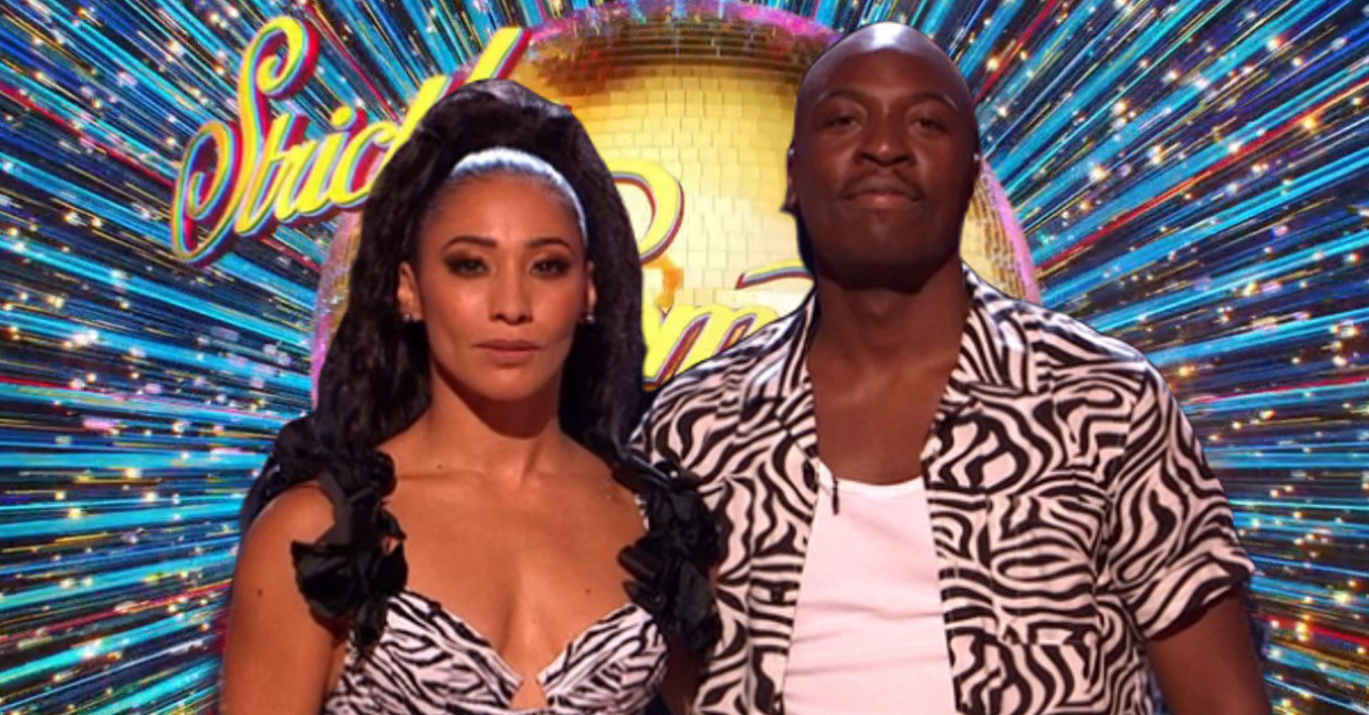 Karen Hauer and Eddie Kadi in front of Strictly logo