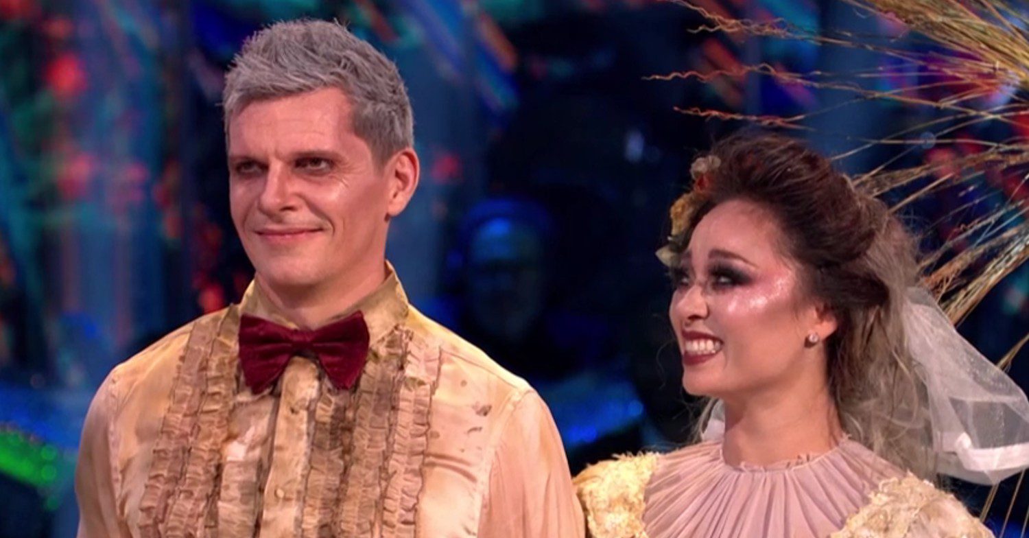 Nigel and Katya smiling in their Halloween costumes on Strictly