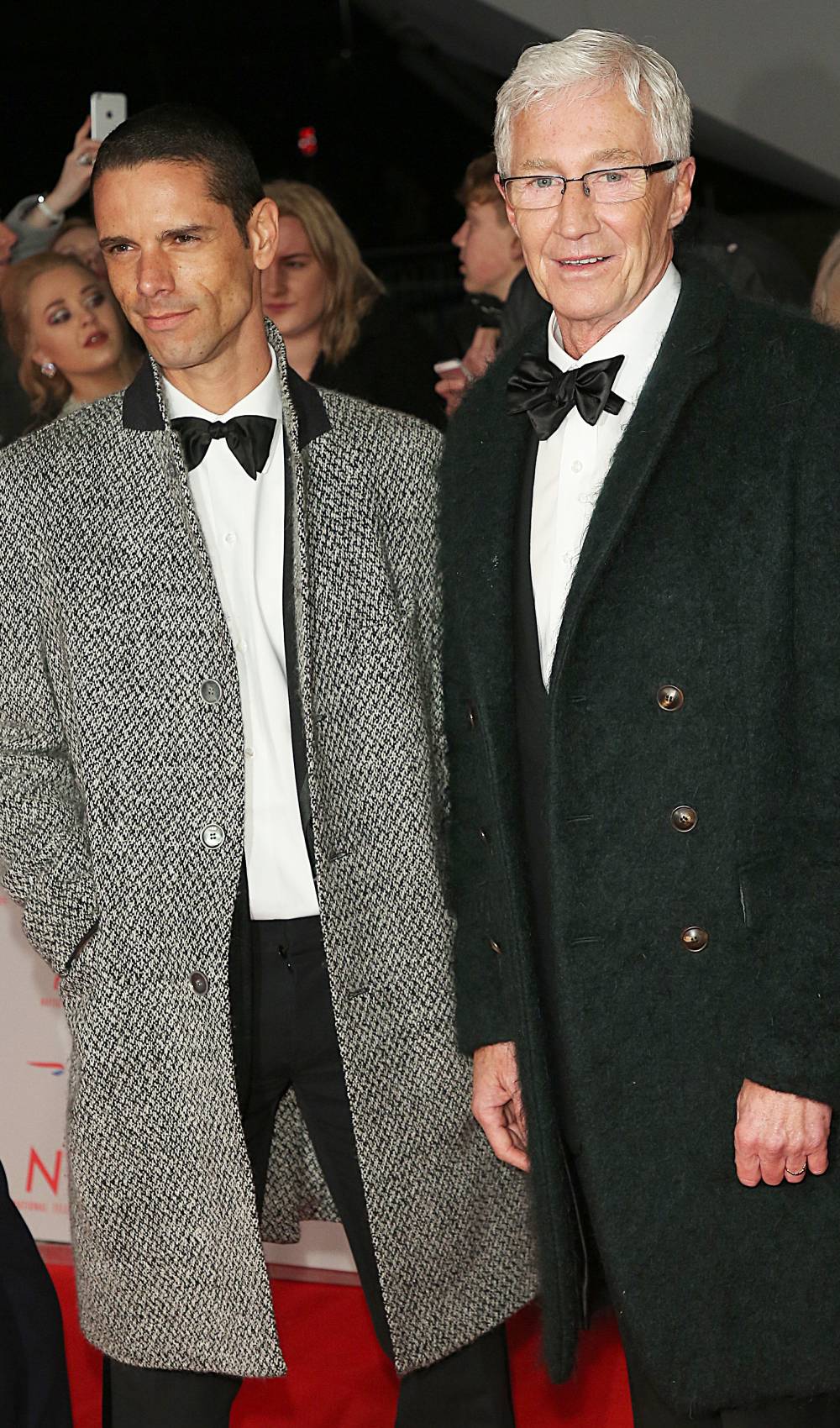 Paul O'Grady and his husband Andre Portasio poses for the camera