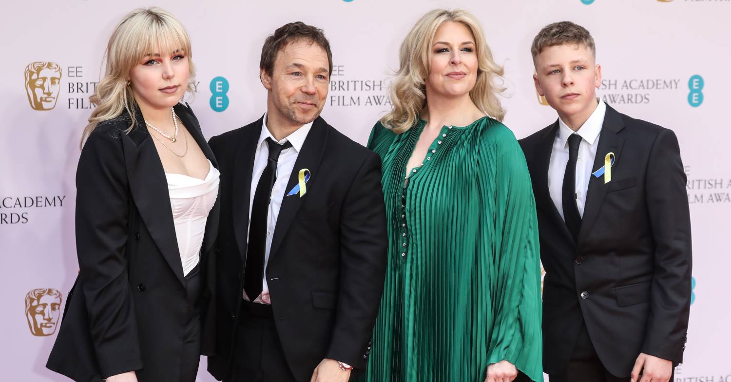 Stephen Graham poses alongside his wife and family