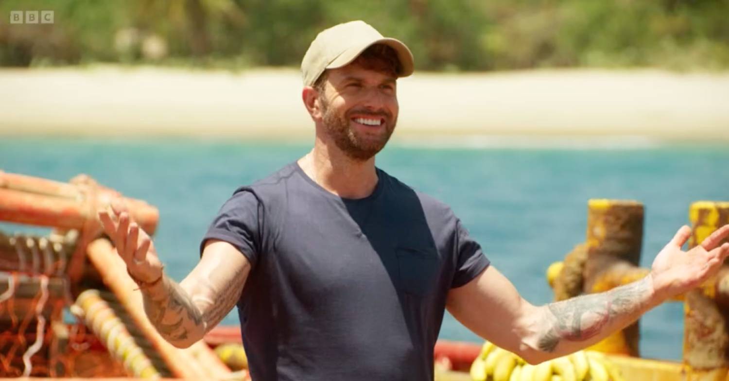 Joel Dommett opens his arms