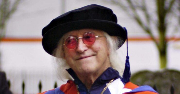 Jimmy Savile looks to the side