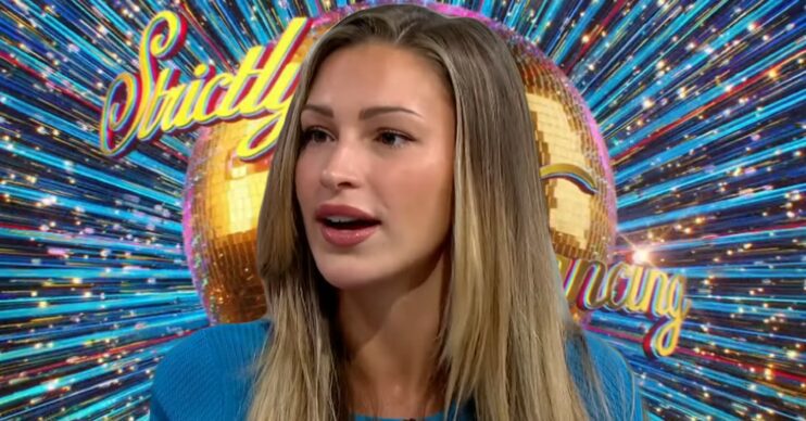 Zara McDermott in front of Strictly logo