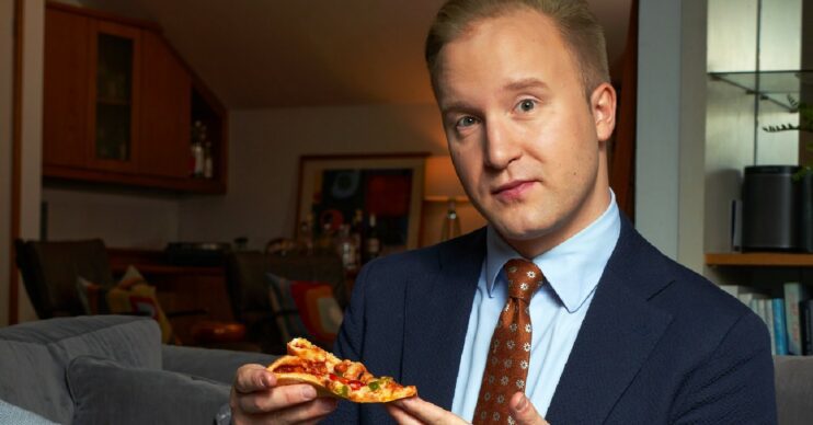 William Hanson holding a pizza