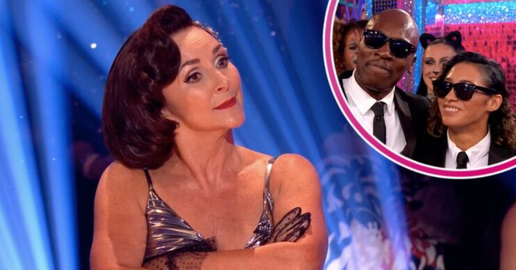 Shirley crossing her arms with Eddie and Karen