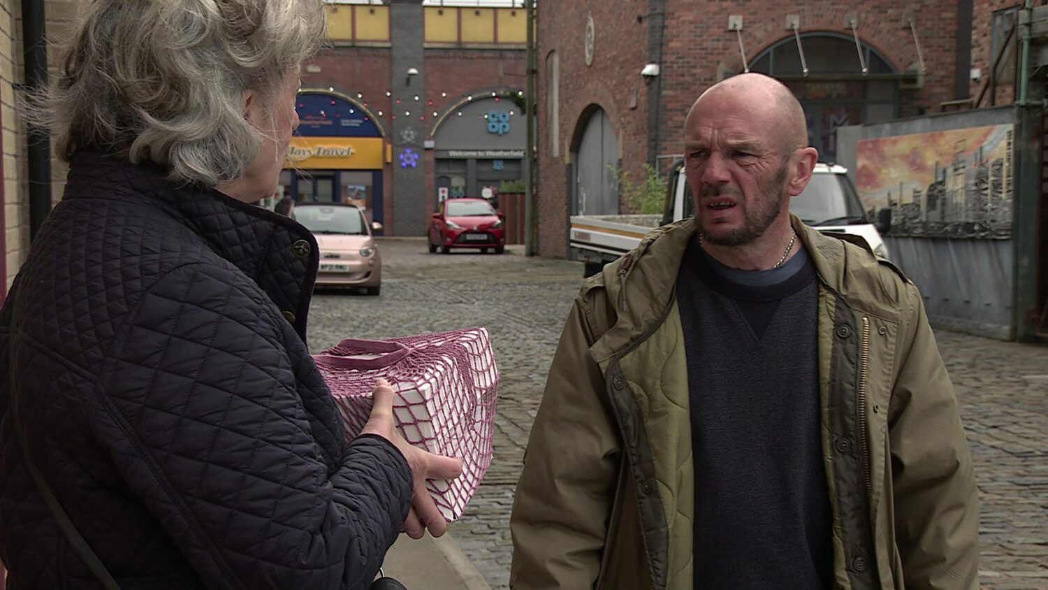 Evelyn arguing with a thug on Corrie
