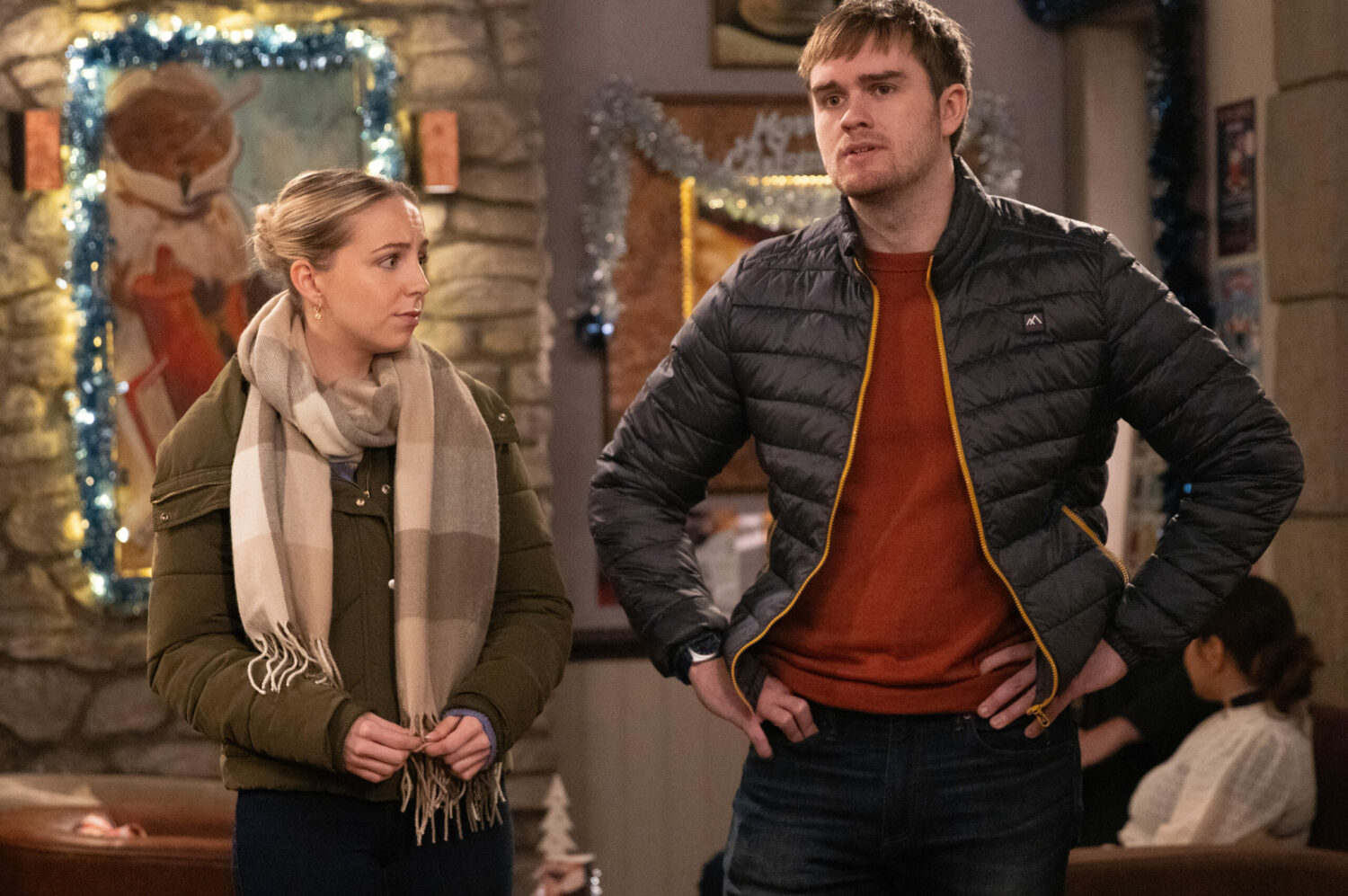 Tom and Belle looking awkward on Emmerdale