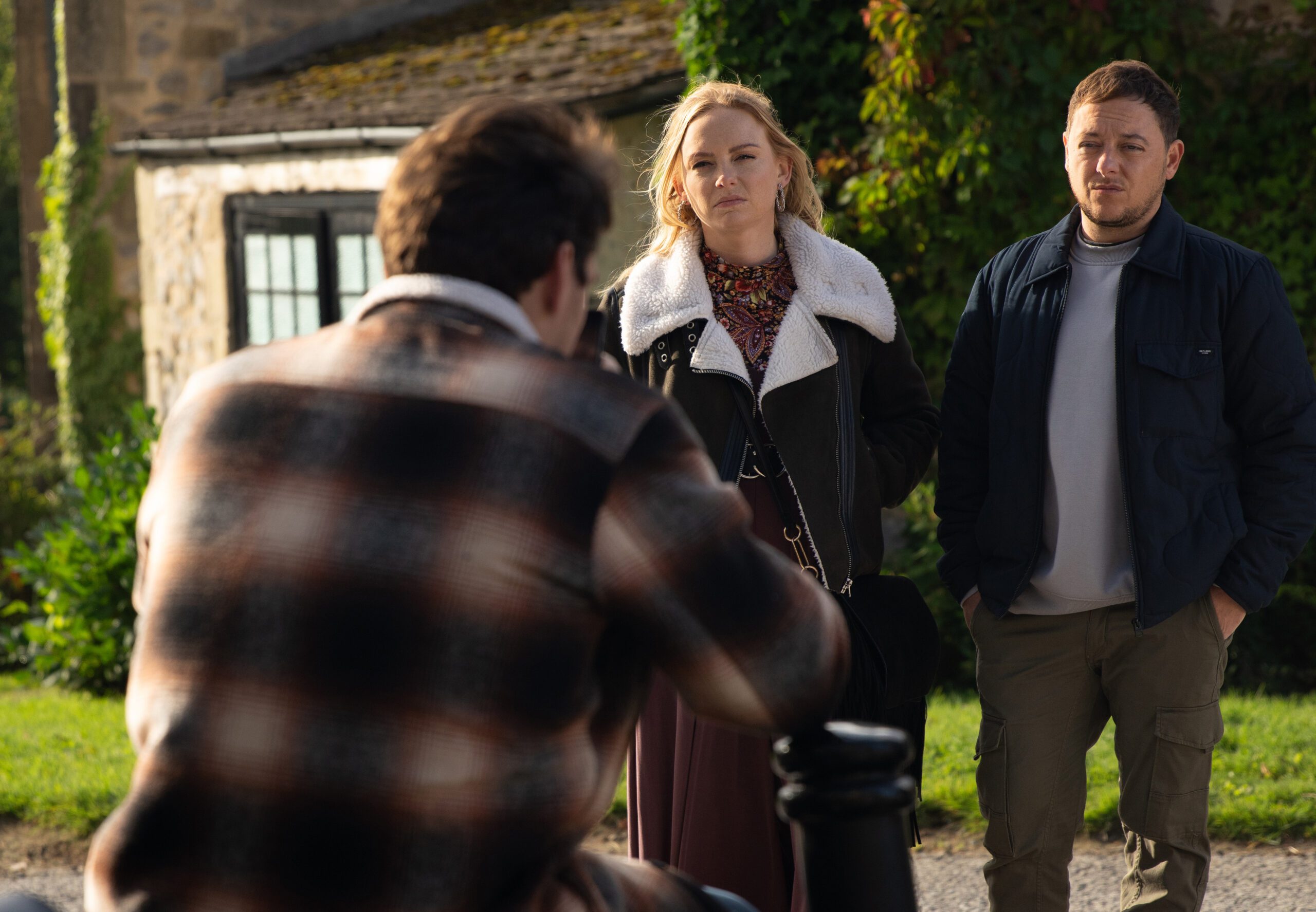 Emmerdale's Amy and Matty are talking to Mack outside