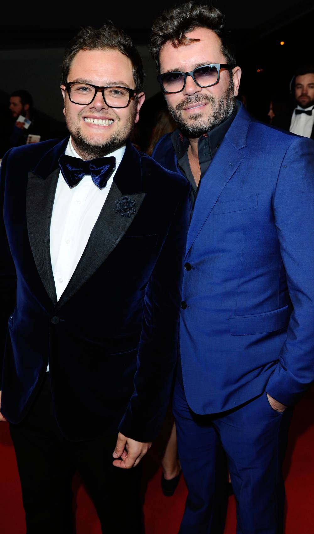 Alan Carr and ex husband Paul Drayton smile