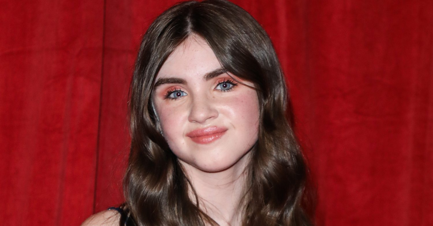 Emmerdale's Amelia Flanagan is smiling on the red carpet