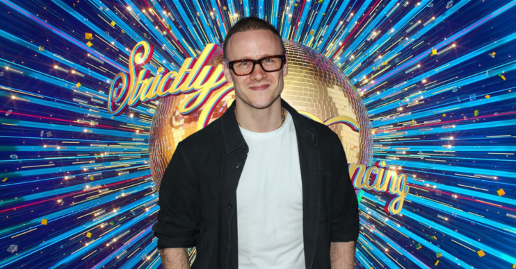 Former Strictly Come Dancing professional Kevin Clifton standing in front of the Strictly logo