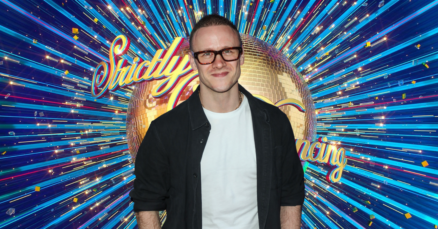 Former Strictly Come Dancing professional Kevin Clifton standing in front of the Strictly logo