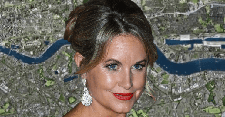 Kim Medcalf in front of the EastEnders logo