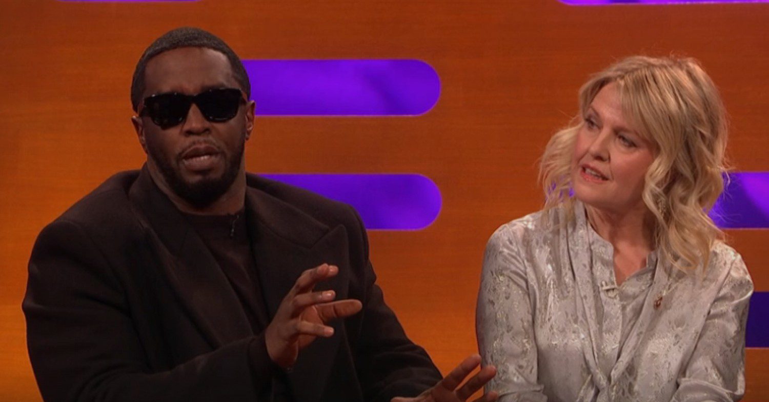 P Diddy wearing sunglasses, sitting next to Ashley Jensen