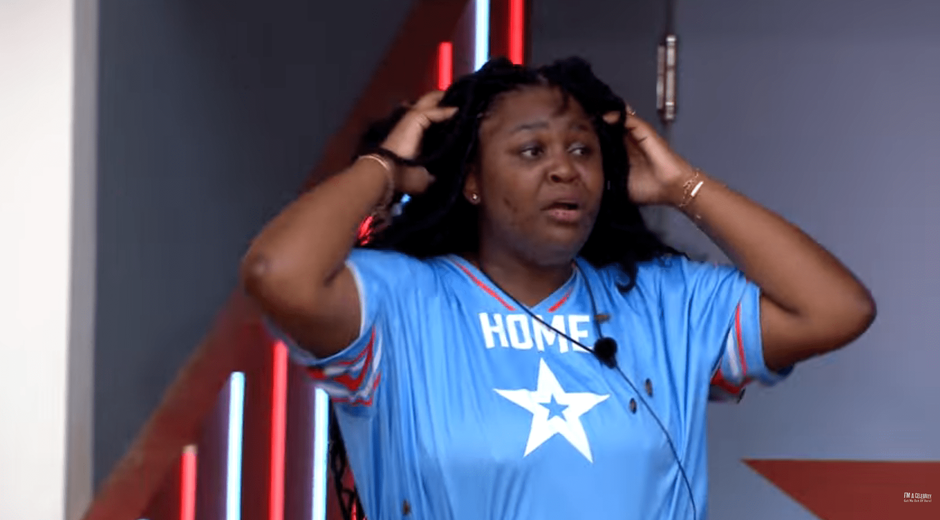Nella looks distraught as she rubs critters out of her hair