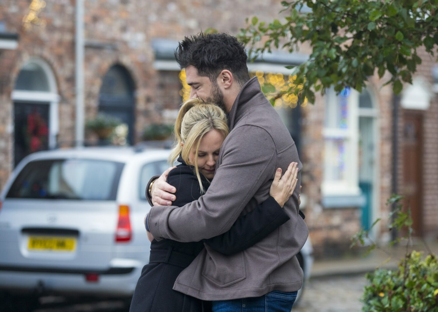 Sarah and Adam hug on Corrie