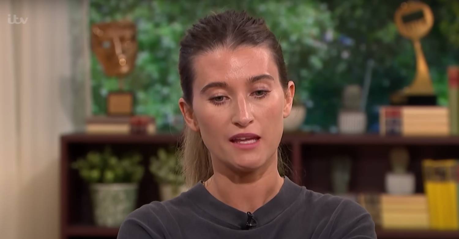 Charley Webb looks downwards