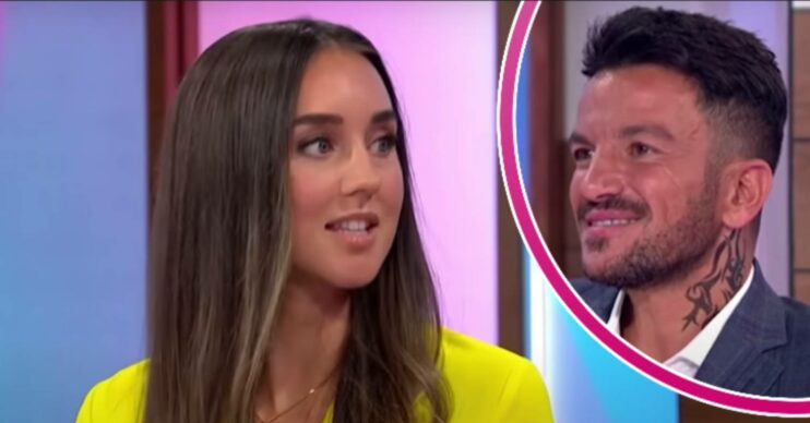 Emily Andre looks to her side, Peter Andre smiles